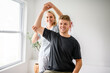 © Louis-Paul Photo - A Modern rehabilitation physiotherapy woman worker with man client leg treatment