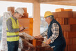 © Ljustina - Construction workers measuring bricks and taking notes on building site