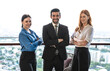 © Jack Tamrong - Businessman and two female colleagues working together at high rise office balcony