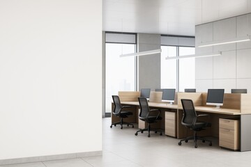 Poster - Modern open-plan office interior with wooden desks and black chairs in bright room with large windows and blank wall space on left side.