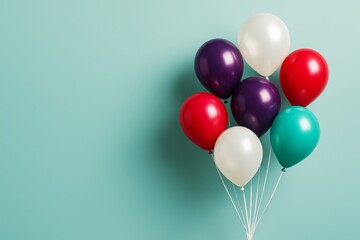 Poster - Colorful glossy balloons floating together on light turquoise background with smooth shadows and abstract minimalistic graphic composition.