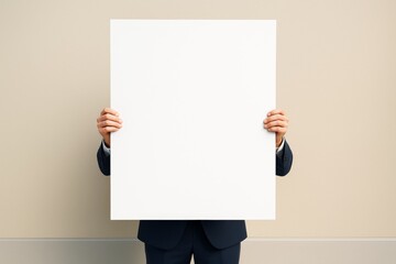Poster - Business person holding large blank poster against beige background for advertisement or branding concept with clean copyspace. Ai generative.