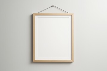 Poster - Minimalistic wooden frame mockup hanging on light wall background for poster, branding, template or design presentation concept use.