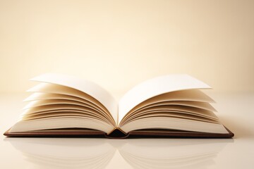 Poster - Open book with curved pages on glossy surface, warm light background, minimal style, symbol of knowledge, creativity, and imagination.