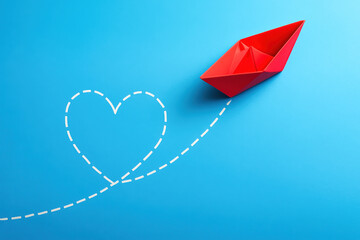 Poster - A red origami boat navigates a marked path shaped like a heart on a blue surface suggesting direction and purposeful movement in business