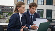 © stockbusters - Colleagues video calling laptop at outdoors workspace closeup. Focused coworkers
