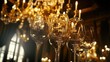 © Suphawan - Fine wine glasses reflecting the golden chandelier light above, creating a luxurious and romantic dinner ambiance