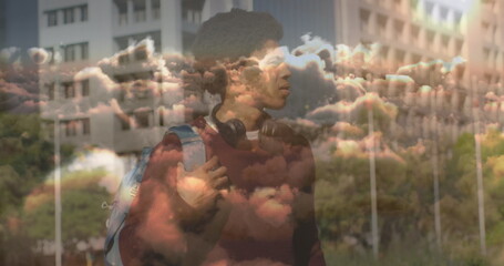 Poster - Image of clouds over african american businessman