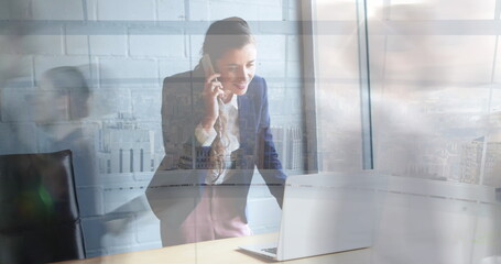 Poster - Image of caucasian businesswoman talking on cellphone over time lapse of blurred people