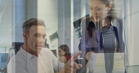 Poster - Image of coworkers discussing over laptop in office and colleagues walking in corridor