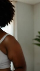 Poster - A woman wearing a white tank top and blue jeans, likely for everyday activities