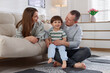 © New Africa - Cute little boy and his parents at home. Lovely family
