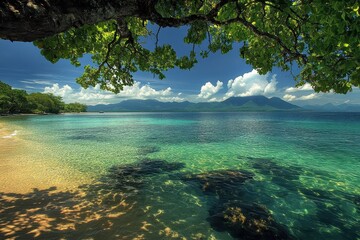 Poster - Serene coastal view with clear waters and rocky shoreline under a vibrant sky in the early afternoon near a tropical beach