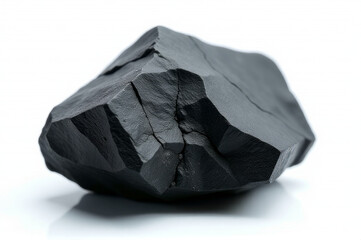 Poster - A solitary black rock sits on a white surface, ideal for use in backgrounds or as a design element