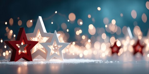 Wall Mural - Three red and white star-shaped decorations arranged on a wooden table surface.