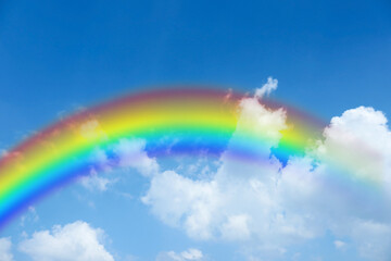 Wall Mural - bright rainbow in blue sky with clouds on sunny day