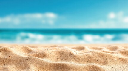 Poster - Soft beach sand with a blurred turquoise ocean and blue sky with small clouds in the background evoking relaxation and summer vacation