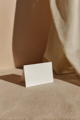 Poster - Minimalist Business Card Mockup with Premium Paper Texture and Soft Shadows on Neutral Fabric Background Professional Branding and Modern Networking Concept