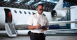 © Andrey Popov - Smiling African American Airline Pilot