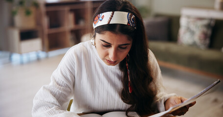 Poster - Student, woman and studying in home with book for test preparation, thesis or knowledge. Learning, education and serious person in living room for college assignment, project and reading information