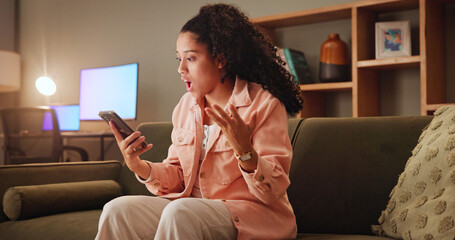 Poster - Woman, shock and phone with texting on sofa, wow and notification for fake news on social media. Girl, smartphone and surprise at night on mobile app, chat and gossip with contact on couch at house