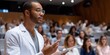 © Iryna - Male speaker presenting at medical conference in auditorium