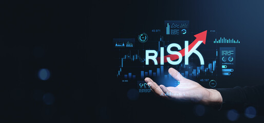 Poster - Hand holding rising risk text with forex trading chart on dark background.