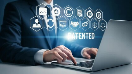 Poster - Man in suit using laptop with patented graphic overlay and business related icons displayed above