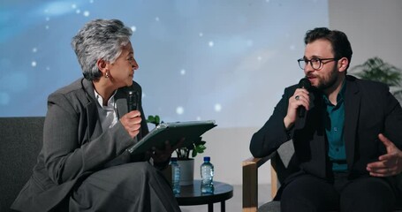 Aufkleber - Stage, event or people with guest in interview for global economy, forum or finance resources. Answer, questions and speaker with mic or tablet in show for financial growth, solution or convention