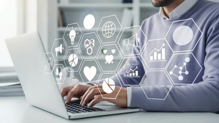 Aufkleber - Man typing on laptop with digital marketing icons overlayed on the screen in a bright office