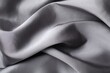 © New Africa - Crumpled grey silk fabric as background, above view