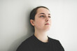 © Louis-Paul Photo - 15 years old teen girl on studio gray look sad