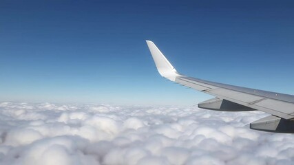 Aufkleber - Airplane wing soaring above a breathtaking sea of clouds, bathed in the warm glow of sunlight, creating a picturesque view during a tranquil flight