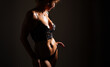 © Kaspars Grinvalds - Silhouette of Woman in Lingerie Under Studio Lighting