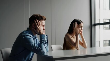 Poster - Office workers suffering severe headache, displaying emotional distress, covering ears, experiencing workplace stress in minimalist workspace with overwhelmed body language