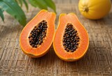 papaya fruit on wooden table
