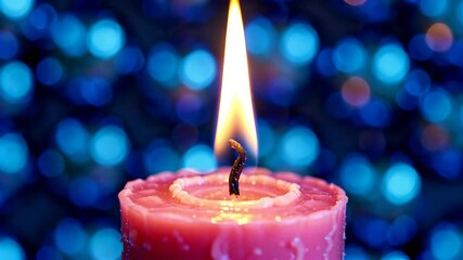 Wall Mural - there is a candle that is lit and is on a table