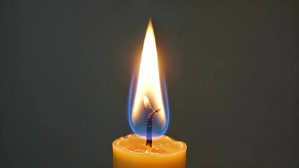 Wall Mural - there is a candle that is lit with a flame on it