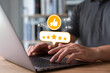 © Thapana_Studio - review and satisfaction concept, Customer giving five star rating and positive feedback on laptop, online reputation management for business and digital marketing performance.