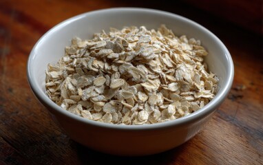 Poster - Bowl of Rolled Oats on Wooden Table, Representing Healthy Eating and Natural Nutrition for Breakfast Cereal Advertising : Generative AI