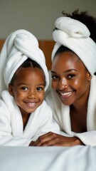 Poster - A mother and daughter relaxing together on a cozy bed