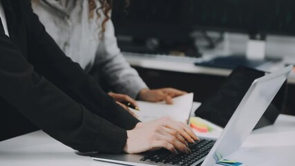 Two asian team working development of programming and encryption technology website design programmers on desk in office