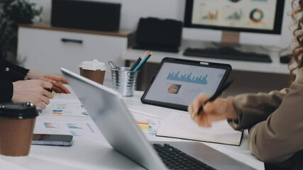 Two asian team working development of programming and encryption technology website design programmers on desk in office
