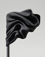 Poster - Dynamic Black Flag Waving Dramatically in Wind on Pole, Fabric Rippling with Natural Movement for Bold Patriotic and Social Impact Branding