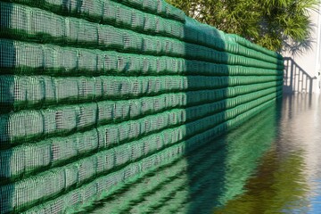 Poster - Flood Protection Sandbag Barrier Shielding Home Foundation in Residential Area for Emergency Response and Disaster Risk Management with Sustainable Materials