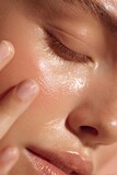 Radiant skin highlighted by a glowing skincare routine, creating a close-up portrait of pure health and beauty and luminous complexion.