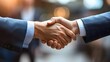 © คงเดช ผาผง - Close up captures successful business handshake between two professionals wea suits symbolizing agreement and partnership in corporate environment indoors.