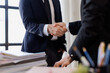 © David - Happy business asian manager handshaking client at meeting. Smiling female hr hiring recruit at job interview, insurance agent, lawyer making contract deal at work with business handshake.