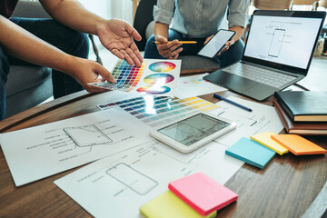 Wall Mural - team of creative web/graphic designer planning, drawing website ux app for mobile phone application 