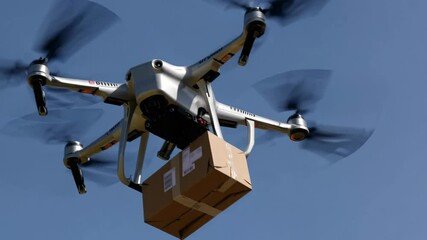 Poster - Drone delivers package over city landscape in bright blue sky during midday hours
